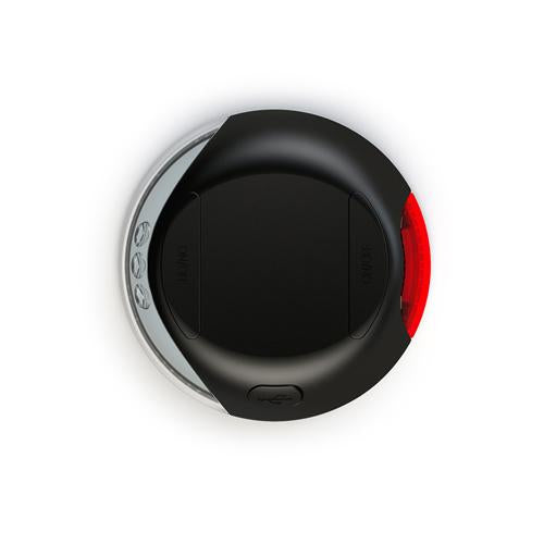 En sort og rød flexi LEDLys til Flexi udtrækkelige liner, flere fjernbetjening på en hvid overflade.
