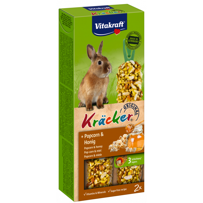 En æske Vitakraft Kräcker, lækker stænger til kaniner med en kanin i.