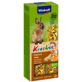 En æske Vitakraft Kräcker, lækker stænger til kaniner med en kanin i.