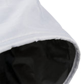 Et nærbillede af en hvid og sort Trixie Tunnel XXL til katten taske.