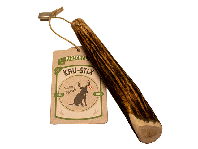 En Kødben Tikki Gevir træpind med et mærke på lavet af Allergivenlige materialer.