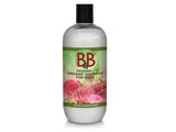 En flaske B&B økologisk hundebalsam med Rosenolie med roser på, tilsat rosenolie for ultimativ konditionering og silkeagtig pelsen.