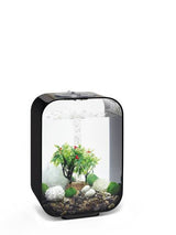 Et lille akvarium med planter og sten i, perfekt til biOrb-entusiaster, der ønsker at skabe en smuk plantekasse med skulpturer-elementer med biOrb fuld dekorationssæt 15L / Winter (vinter) xmas.