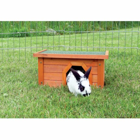 En kanin er komfortabelt bosat i en Natura Hus til udendørs løbegård, 40 x 20 x 28 cm (gnaverhjem).