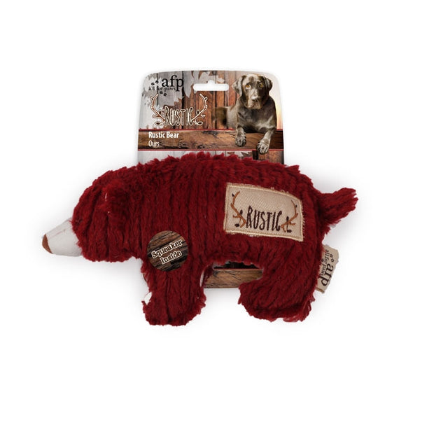 Et HundeLegetøj fra afp med en rustik bjørn på, plus legetøjsbamse med piv.