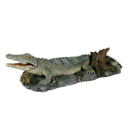 En Trixie Akvariepynt, Krokodille - 26 cm statue af en krokodille siddende på en træstamme.