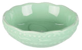 En grøn skål med mønster på lavet af Trixie Katteskål af keramik, smukt design.