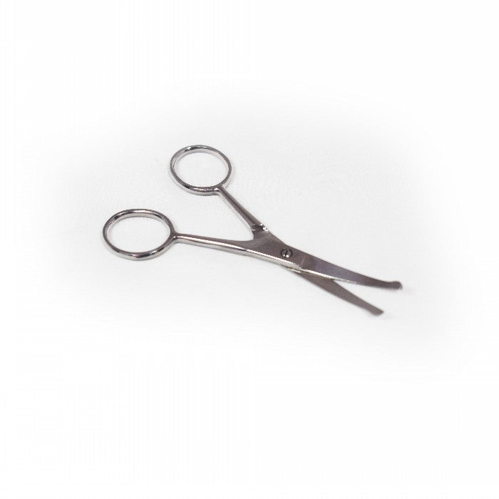 En Potesaks saks på en hvid overflade, placeret ved siden af en Tools 2 groom Saks.