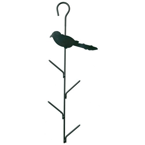 En sort fugl sat på en Trixie Mejsebolde holder af metal.