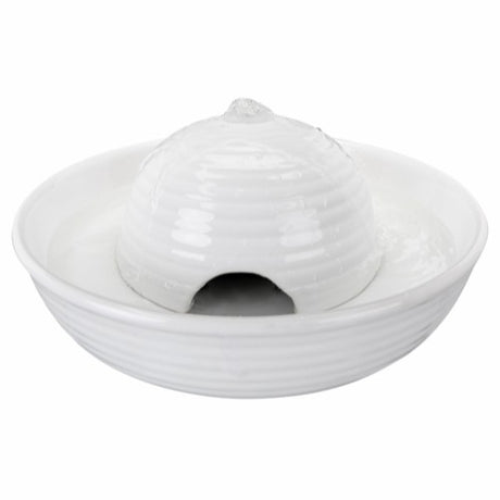 En hvid keramikskål med hul i, ligner en Drikkefontæne Vital Flow, Keramik 0,8L fra Trixie.